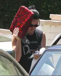 ​Katy Perry heads out of a friend's Los Angeles house