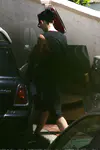 ​Katy Perry heads out of a friend's Los Angeles house