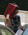 ​Katy Perry heads out of a friend's Los Angeles house