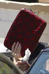 ​Katy Perry heads out of a friend's Los Angeles house