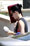​Katy Perry heads out of a friend's Los Angeles house