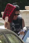 ​Katy Perry heads out of a friend's Los Angeles house