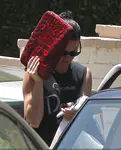 ​Katy Perry heads out of a friend's Los Angeles house