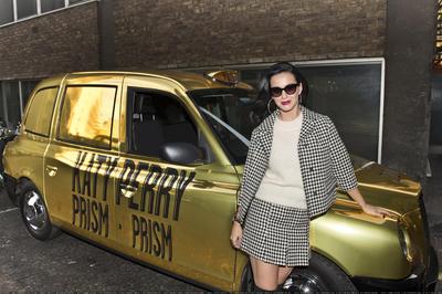 Katy Perry photographed with her custom made PRISM taxi in London