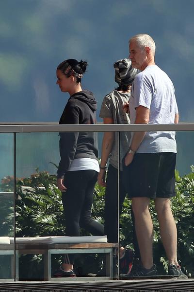 Katy Perry enjoys the view of Sydney Harbour from her hotel balcony